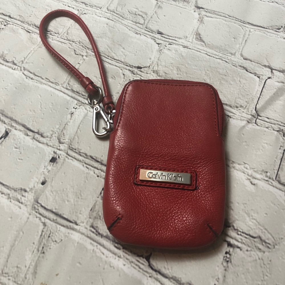 Red Calvin Klein wristlet, smartphone wallet.
